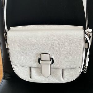 Medium sized cream colored MK crossbody bag with gold hardware. Lightly worn.